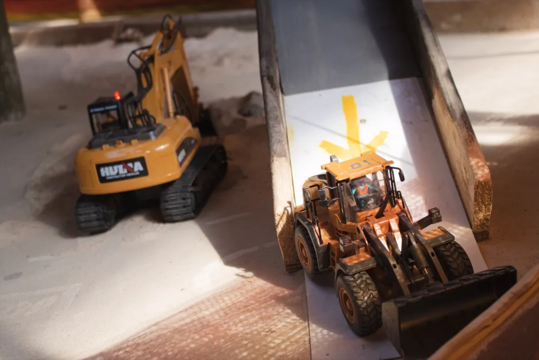 Close-up of a remote-control front loader on the multi-level dig course